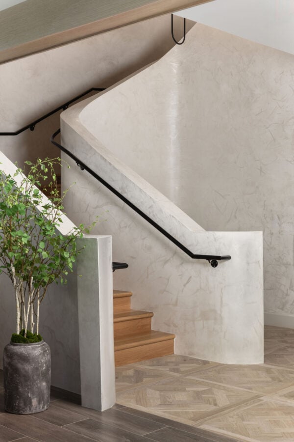 Interior stairwell with venetian plaster and upscale multifamily design details