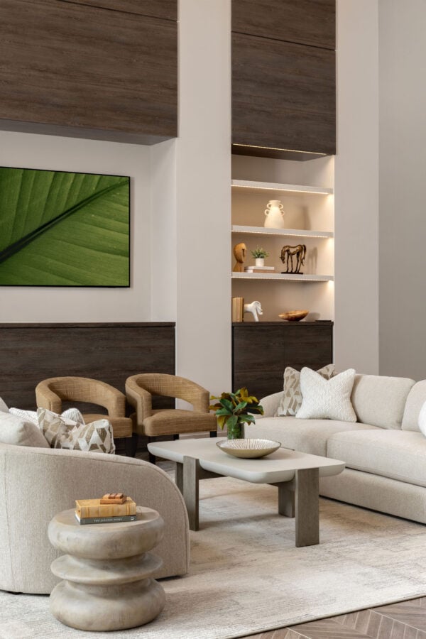 Spacious apartment clubhouse lounge with large windows and modern furniture